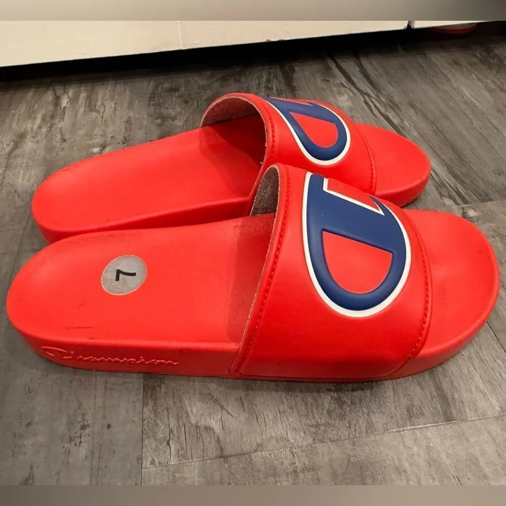 Men’s champion slides. Red and blue, size 7. Gently worn.
